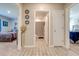 Hallway with light walls and tile floors, connecting bedrooms and a bath at 1475 Haines Dr, Winter Haven, FL 33881