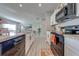 Modern kitchen with stainless steel appliances and white shaker cabinets at 1475 Haines Dr, Winter Haven, FL 33881