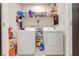 Laundry room with washer, dryer, and overhead storage at 1475 Haines Dr, Winter Haven, FL 33881