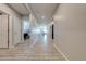Hallway with tile flooring and access to bedrooms and bathroom at 1475 Haines Dr, Winter Haven, FL 33881
