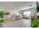 Open concept living room with tile floors and neutral color palette at 1475 Haines Dr, Winter Haven, FL 33881