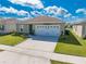 Single story house with a two car garage and well-manicured lawn at 1475 Haines Dr, Winter Haven, FL 33881
