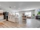 Open concept kitchen and living area with tile floors and modern appliances at 1475 Haines Dr, Winter Haven, FL 33881