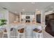 Modern kitchen with white cabinets, granite countertops, and kitchen island with seating at 1475 Haines Dr, Winter Haven, FL 33881