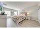 Main bedroom with large bed, light wood furniture, and plenty of natural light at 1475 Haines Dr, Winter Haven, FL 33881