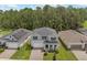 Two-story house with solar panels and landscaped yard at 2864 Sanctuary Dr, Clermont, FL 34714