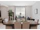Dining area with wood table, chairs, and a large window at 2864 Sanctuary Dr, Clermont, FL 34714