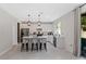 Modern kitchen with white cabinets, stainless steel appliances, and an island at 2864 Sanctuary Dr, Clermont, FL 34714