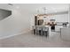 Modern kitchen with white cabinets, large island, and stainless steel appliances at 2864 Sanctuary Dr, Clermont, FL 34714