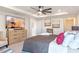 Main bedroom with large TV, dresser, and comfortable seating at 2864 Sanctuary Dr, Clermont, FL 34714