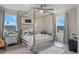 Bright bedroom with canopy bed and plenty of natural light at 2864 Sanctuary Dr, Clermont, FL 34714