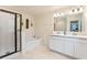 Spa-like bathroom with double vanity, soaking tub, and glass shower at 2864 Sanctuary Dr, Clermont, FL 34714