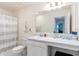 Clean bathroom with single sink vanity and shower/tub combo at 2864 Sanctuary Dr, Clermont, FL 34714