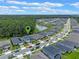 Property location view with pond and surrounding houses at 2864 Sanctuary Dr, Clermont, FL 34714