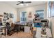 Home office with a large desk and multiple monitors at 2864 Sanctuary Dr, Clermont, FL 34714
