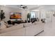 Open concept living room with sectional sofa and view of the dining area at 2864 Sanctuary Dr, Clermont, FL 34714