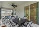 Covered patio with seating area and pond feature at 2864 Sanctuary Dr, Clermont, FL 34714