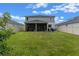 Two-story house with covered patio and fenced backyard at 2864 Sanctuary Dr, Clermont, FL 34714