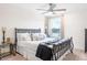 Spacious bedroom with a ceiling fan and large window at 2864 Sanctuary Dr, Clermont, FL 34714