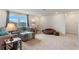 Open living area with sectional sofa and large windows at 2864 Sanctuary Dr, Clermont, FL 34714