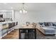 Dining area with kitchen bar and gray L-shaped sofa at 13905 Fairway Island Dr # 1022, Orlando, FL 32837