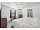 Bedroom with king-size bed, dresser, and en-suite bathroom at 13905 Fairway Island Dr # 1022, Orlando, FL 32837