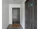 Condo entryway with dark gray doors and a welcome mat at 13905 Fairway Island Dr # 1022, Orlando, FL 32837