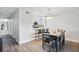 Bright dining area with kitchen bar and hardwood floors at 13905 Fairway Island Dr # 1022, Orlando, FL 32837