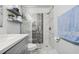 Modern bathroom with glass shower, floating shelves and marble floors at 13905 Fairway Island Dr # 1022, Orlando, FL 32837