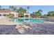 Community pool with brick pavers and gazebo at 13905 Fairway Island Dr # 1022, Orlando, FL 32837