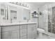 Updated bathroom with double vanity, marble flooring, and a glass shower at 13905 Fairway Island Dr # 1022, Orlando, FL 32837