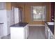 Kitchen with white cabinets, island, and tiled floor at 284 Pinestraw Cir, Altamonte Springs, FL 32714