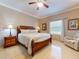 Spacious bedroom with wooden furniture, ceiling fan, and large windows at 1185 Coachwood Ct, Longwood, FL 32779