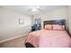Bedroom with double bed, ceiling fan, and a workspace at 1302 Belmar Ter, Deltona, FL 32725