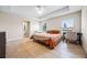 Bedroom with double bed, ceiling fan, and access to bathroom at 1302 Belmar Ter, Deltona, FL 32725