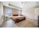 Bedroom with double bed, ceiling fan, and tile floors at 1302 Belmar Ter, Deltona, FL 32725