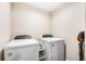 Laundry room with side-by-side washer and dryer, and storage space at 1302 Belmar Ter, Deltona, FL 32725
