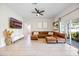 Spacious living room with L-shaped sectional sofa and large TV at 1302 Belmar Ter, Deltona, FL 32725