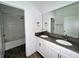 Clean bathroom with double vanity and a large mirror at 5013 Center Ct, St Cloud, FL 34772