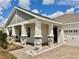 Front view of a charming house with a porch at 5013 Center Ct, Saint Cloud, FL 34772