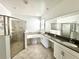 Elegant bathroom with double vanity, soaking tub, and walk-in shower at 5013 Center Ct, St Cloud, FL 34772