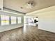 Open living room with kitchen view and tile floors at 5013 Center Ct, St Cloud, FL 34772