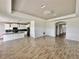 Open living room with kitchen view and tile floors at 5013 Center Ct, St Cloud, FL 34772