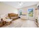 Bedroom with crib, rocker, dresser, and plenty of natural light at 1302 Belmar Ter, Deltona, FL 32725