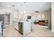 Open concept kitchen and living area with modern finishes at 1302 Belmar Ter, Deltona, FL 32725