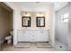 Updated bathroom with double vanity, walk-in shower, and toilet at 1302 Belmar Ter, Deltona, FL 32725