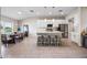 Open concept kitchen with island, white cabinets, and stainless steel appliances at 1302 Belmar Ter, Deltona, FL 32725
