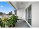 Covered patio with sliding door access and potted plants at 1302 Belmar Ter, Deltona, FL 32725