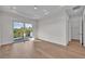 Bright bedroom with hardwood floors and sliding glass doors leading to a private balcony at 1917 S Lakemont Ave, Winter Park, FL 32792