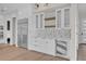 Modern kitchen with white cabinets, beverage cooler, and stainless steel refrigerator at 1917 S Lakemont Ave, Winter Park, FL 32792